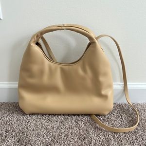 Tan handbag with crossbody strap